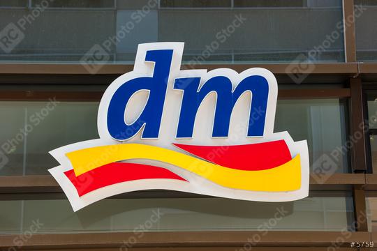 FRANKFURT, GERMANY MARCH, 2017: Dm drogeriemarkt logo. Headquartered in Karlsruhe, Dm-drogerie markt is a chain of retail drugstore chain for cosmetics, healthcare and household products and food.  : Stock Photo or Stock Video Download rcfotostock photos, images and assets rcfotostock | RC Photo Stock.: