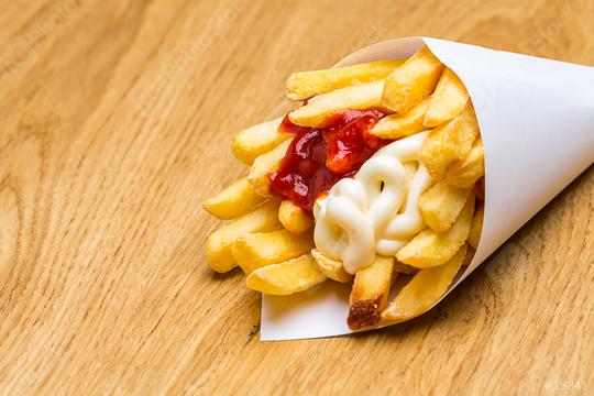 french fries in a bag with ketchup and mayonnaise  : Stock Photo or Stock Video Download rcfotostock photos, images and assets rcfotostock | RC-Photo-Stock.:
