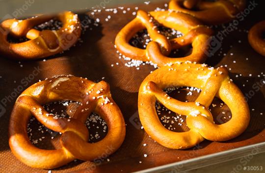 Fresh Bavarian pretzels with salt on a baking tray from the bakery  : Stock Photo or Stock Video Download rcfotostock photos, images and assets rcfotostock | RC Photo Stock.: