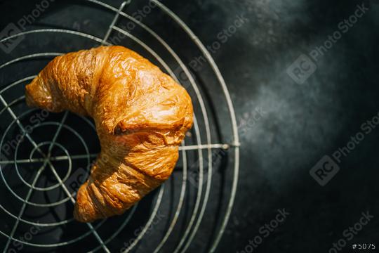 fresh croissants on a bakery gird, top view  : Stock Photo or Stock Video Download rcfotostock photos, images and assets rcfotostock | RC Photo Stock.: