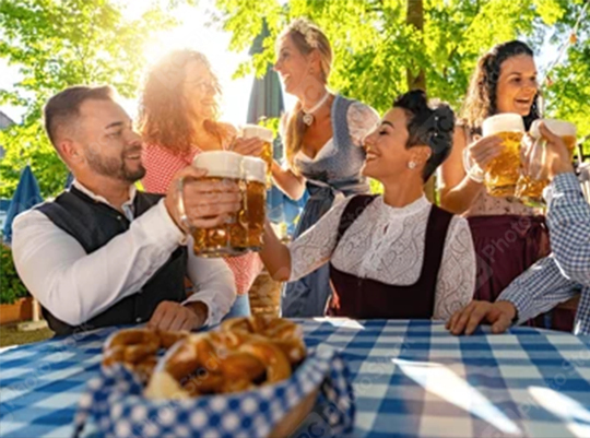 Friends sitting in beer garden or oktoberfest with beer glasses toasting to each other in Bavaria, Germany  : Stock Photo or Stock Video Download rcfotostock photos, images and assets rcfotostock | RC Photo Stock.: