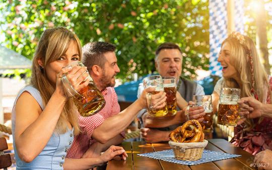 Friends, three men, two women, sitting in beer garden with beer glasses toasting to each other in Bavaria, Germany  : Stock Photo or Stock Video Download rcfotostock photos, images and assets rcfotostock | RC Photo Stock.: