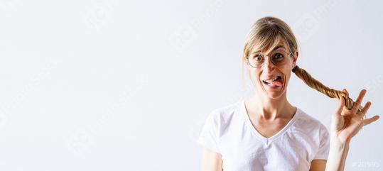Funny blond woman in white shirt posing on gray background, Having fun and hold hair tail or Braid and showing tongue. People lifestyle concept, with copy space for individual text  : Stock Photo or Stock Video Download rcfotostock photos, images and assets rcfotostock | RC Photo Stock.: