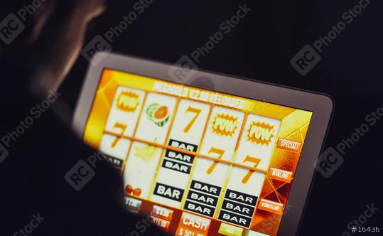 Gambling addicted man with glasses in front of online casino slot machine on laptop computer at night - loosing his money. Dramatic low light grain shot.  : Stock Photo or Stock Video Download rcfotostock photos, images and assets rcfotostock | RC Photo Stock.: