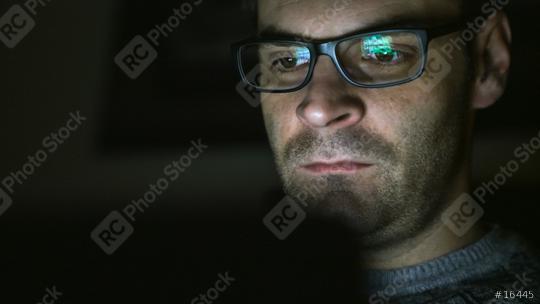 Gambling addicted man with glasses in front of online casino slot machine on laptop computer at night - loosing his money. Dramatic low light grain shot.  : Stock Photo or Stock Video Download rcfotostock photos, images and assets rcfotostock | RC Photo Stock.: