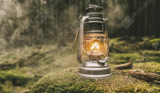 Gasoline lantern on a tree trunk in the deep forest with mist, Hiker, Travel Outdoor Concept image  : Stock Photo or Stock Video Download rcfotostock photos, images and assets rcfotostock | RC Photo Stock.: