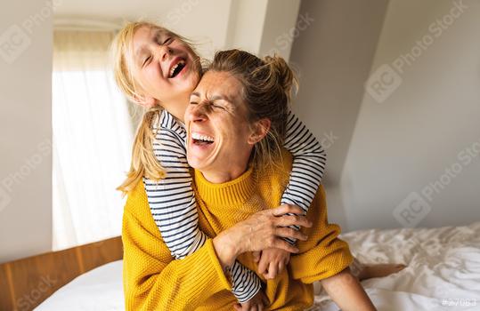 girl and her mother enjoy playing in the bedroom. Good time at home. Family playing on the bed in the bedroom.  : Stock Photo or Stock Video Download rcfotostock photos, images and assets rcfotostock | RC Photo Stock.: