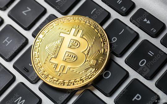 Golden Bitcoin on notebook  : Stock Photo or Stock Video Download rcfotostock photos, images and assets rcfotostock | RC Photo Stock.: