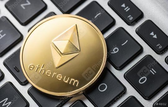 Golden ethereum coin on notebook  : Stock Photo or Stock Video Download rcfotostock photos, images and assets rcfotostock | RC Photo Stock.: