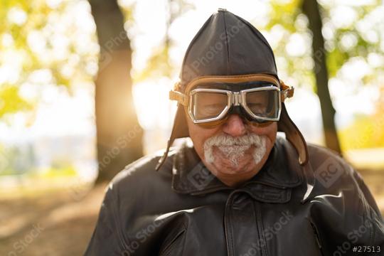 grandfather in aviator gear smiling, with autumn trees and sunlight in the background. Dementia retirement home concept image  : Stock Photo or Stock Video Download rcfotostock photos, images and assets rcfotostock | RC Photo Stock.: