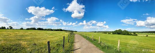 Green field with trees and blue sky. Panoramic view to grass, trees and flowers on the hill on sunny spring day  : Stock Photo or Stock Video Download rcfotostock photos, images and assets rcfotostock | RC Photo Stock.: