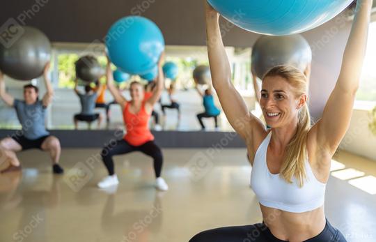 Group of diverse people in a receding line doing pilates in a gym balancing over the gym balls toning their muscles. Healthy sports lifestyle, Fitness, Healthy concept.  : Stock Photo or Stock Video Download rcfotostock photos, images and assets rcfotostock | RC Photo Stock.: