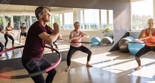 Group of people doing hula hoop during an exercise class in a gym. Healthy sports lifestyle, Fitness, Healthy concept.  : Stock Photo or Stock Video Download rcfotostock photos, images and assets rcfotostock | RC Photo Stock.: