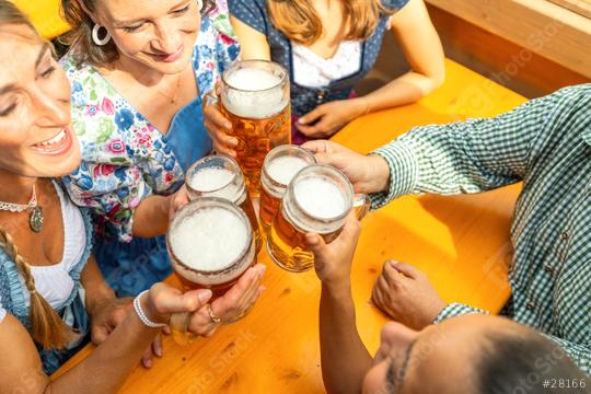 Group of people in traditional Bavarian outfits or tracht toasting with beer steins in a beer tent at  oktoberfest festival or dult in germany  : Stock Photo or Stock Video Download rcfotostock photos, images and assets rcfotostock | RC Photo Stock.: