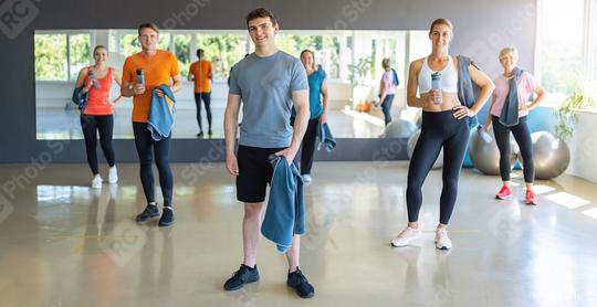 Group of people with gym equipment smiling and standing in a fitness center. Teamwork Concept image  : Stock Photo or Stock Video Download rcfotostock photos, images and assets rcfotostock | RC Photo Stock.: