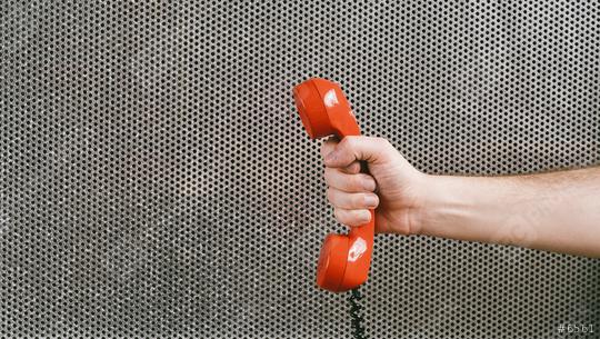 hand holding a red telephone receiver, office concept image  : Stock Photo or Stock Video Download rcfotostock photos, images and assets rcfotostock | RC Photo Stock.: