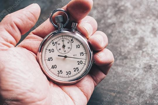 hand holding chronometer  : Stock Photo or Stock Video Download rcfotostock photos, images and assets rcfotostock | RC Photo Stock.: