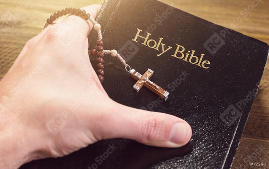 Hand holding Holy Bible with crucifix  : Stock Photo or Stock Video Download rcfotostock photos, images and assets rcfotostock | RC Photo Stock.: