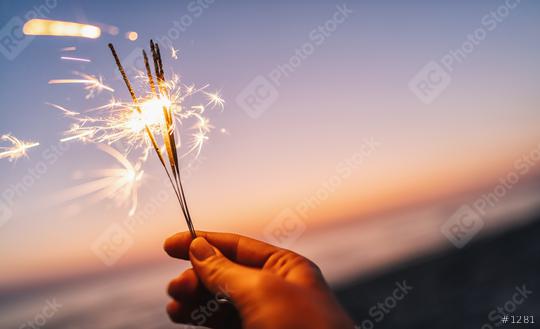 hand holding sparkler at sunset light  : Stock Photo or Stock Video Download rcfotostock photos, images and assets rcfotostock | RC Photo Stock.: