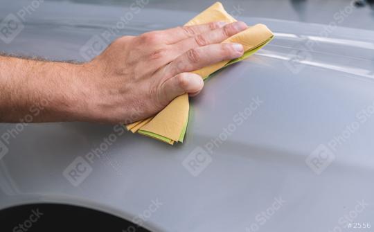 hand holds the microfiber in hand and polishes the car  : Stock Photo or Stock Video Download rcfotostock photos, images and assets rcfotostock | RC Photo Stock.: