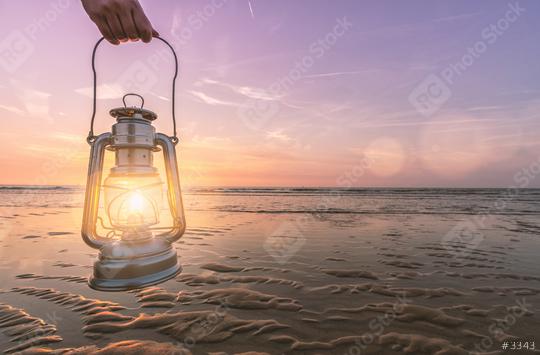hand holds vintage lantern at the beach at sunset. copyspace for your individual text.  : Stock Photo or Stock Video Download rcfotostock photos, images and assets rcfotostock | RC Photo Stock.: