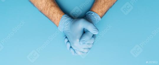 Hand in medical gloves.  Medical banner on blue background. Care concept image  : Stock Photo or Stock Video Download rcfotostock photos, images and assets rcfotostock | RC Photo Stock.: