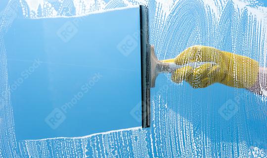 Hand in yellow rubber glove cleaning window on a blue sky   : Stock Photo or Stock Video Download rcfotostock photos, images and assets rcfotostock | RC Photo Stock.: