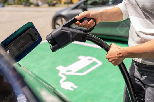 Hand inserting a DC CCS2 EV charging plug into electric car sock  : Stock Photo or Stock Video Download rcfotostock photos, images and assets rcfotostock | RC Photo Stock.: