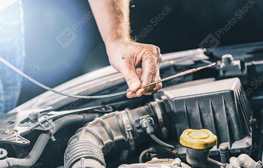 Hand mechanic in repairing car, check the Oil  : Stock Photo or Stock Video Download rcfotostock photos, images and assets rcfotostock | RC Photo Stock.: