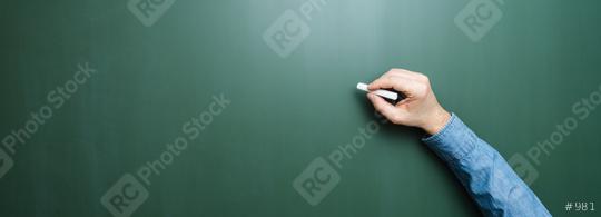Hand of teacher holding chalk in front of blank blackboard  : Stock Photo or Stock Video Download rcfotostock photos, images and assets rcfotostock | RC Photo Stock.: