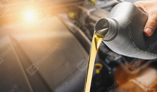 Hand Pouring oil to car engine, Fresh oil poured during an oil change to a car.  : Stock Photo or Stock Video Download rcfotostock photos, images and assets rcfotostock | RC Photo Stock.: