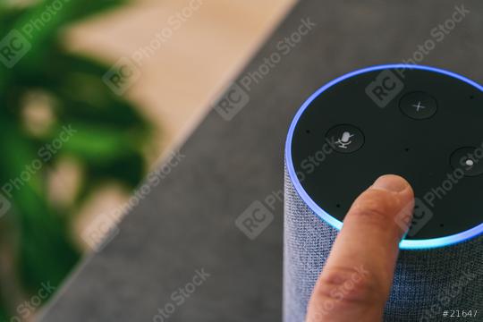 hand touching voice controlled speaker and personal Assistent at home  : Stock Photo or Stock Video Download rcfotostock photos, images and assets rcfotostock | RC Photo Stock.: