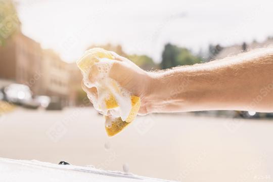 hand wring out a sponge for washing car  : Stock Photo or Stock Video Download rcfotostock photos, images and assets rcfotostock | RC Photo Stock.: