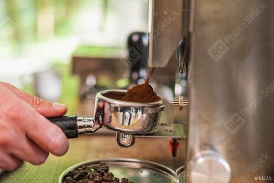 Hands of barista holding portafilter filled with ground coffee preparing to brew with machine  : Stock Photo or Stock Video Download rcfotostock photos, images and assets rcfotostock | RC Photo Stock.: