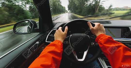 hands of car driver on steering wheel, Driving car at a rainy day on a country road,  road trip - POV, first person view shot  : Stock Photo or Stock Video Download rcfotostock photos, images and assets rcfotostock | RC Photo Stock.: