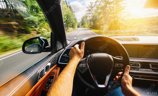 hands of car driver on steering wheel, Driving car at summer day on a country road, having fun driving the empty highway on tour journey - POV, first person view shot  : Stock Photo or Stock Video Download rcfotostock photos, images and assets rcfotostock | RC Photo Stock.: