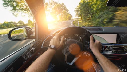 hands of car driver on steering wheel, road trip, driving on forest road  : Stock Photo or Stock Video Download rcfotostock photos, images and assets rcfotostock | RC Photo Stock.: