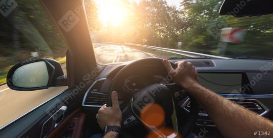 hands of car driver on stheering wheel, road trip, driving on forest road  : Stock Photo or Stock Video Download rcfotostock photos, images and assets rcfotostock | RC Photo Stock.: