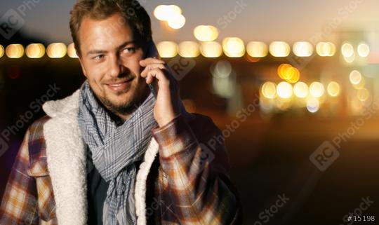 Handsome young man speaking on smart phone at autumn sunset in city  : Stock Photo or Stock Video Download rcfotostock photos, images and assets rcfotostock | RC Photo Stock.: