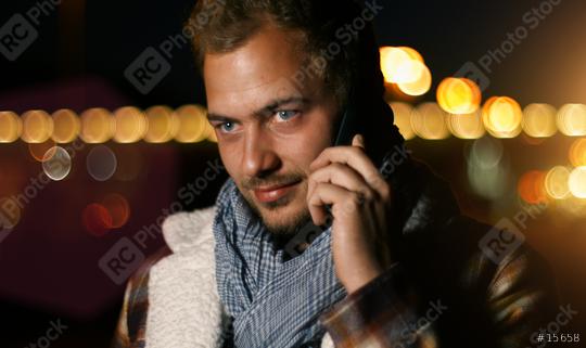 Handsome young man speaking on smart phone at autumn sunset in city  : Stock Photo or Stock Video Download rcfotostock photos, images and assets rcfotostock | RC Photo Stock.: