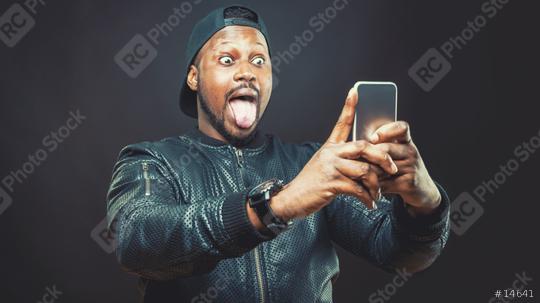 Handsome young man use his smart phone for a selfie shot   : Stock Photo or Stock Video Download rcfotostock photos, images and assets rcfotostock | RC Photo Stock.: