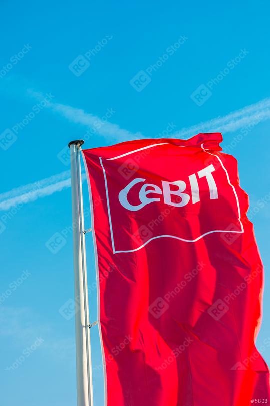 HANNOVER, GERMANY MARCH, 2017: Cebit logo on a flag against blue sky. The Cebit is the biggest trade fair for information technology in the world.  : Stock Photo or Stock Video Download rcfotostock photos, images and assets rcfotostock | RC Photo Stock.: