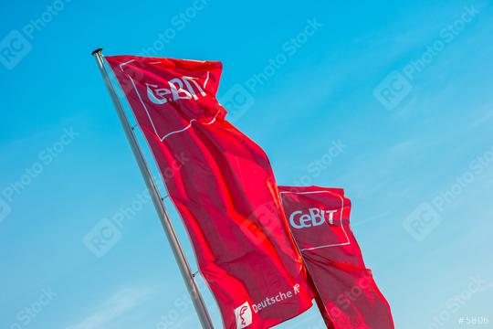 HANNOVER, GERMANY MARCH, 2017: Cebit logo on flags against blue sky. The Cebit is the biggest trade fair for information technology in the world.  : Stock Photo or Stock Video Download rcfotostock photos, images and assets rcfotostock | RC Photo Stock.:
