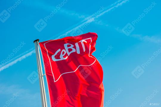 HANNOVER, GERMANY MARCH, 2017: Cebit sign on a flag against blue sky. The Cebit is the biggest trade fair for information technology in the world.  : Stock Photo or Stock Video Download rcfotostock photos, images and assets rcfotostock | RC Photo Stock.: