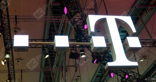 HANNOVER, GERMANY MARCH, 2017: The Logo of Deutsche Telekom on a Fair. There are around 750 so called "T-Punkt" shops which sell products and services of Deutsche Telekom.  : Stock Photo or Stock Video Download rcfotostock photos, images and assets rcfotostock | RC Photo Stock.: