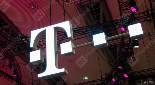 HANNOVER, GERMANY MARCH, 2017: The Logo of Deutsche Telekom on a Fair. There are around 750 so called "T-Punkt" shops which sell products and services of Deutsche Telekom.  : Stock Photo or Stock Video Download rcfotostock photos, images and assets rcfotostock | RC Photo Stock.:
