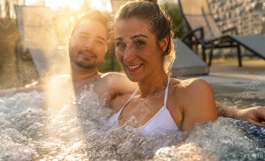 Happy couple enjoying relaxing time in hot tub water outside on vacation  : Stock Photo or Stock Video Download rcfotostock photos, images and assets rcfotostock | RC Photo Stock.: