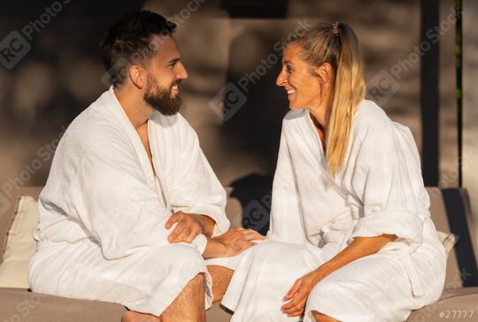 Happy couple in white robes talking and smiling in the sunlight  : Stock Photo or Stock Video Download rcfotostock photos, images and assets rcfotostock | RC Photo Stock.: