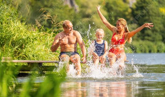 Happy family bathing and splashing water with their foot at jetty on a river in summer  : Stock Photo or Stock Video Download rcfotostock photos, images and assets rcfotostock | RC Photo Stock.: