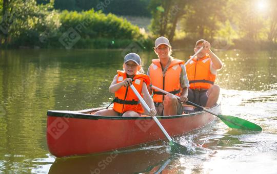 Happy family of three canoeing on a river, with sunlight reflecting on the water around them at summer. Family on kayak ride. Wild nature and water fun on summer vacation.  : Stock Photo or Stock Video Download rcfotostock photos, images and assets rcfotostock | RC Photo Stock.: